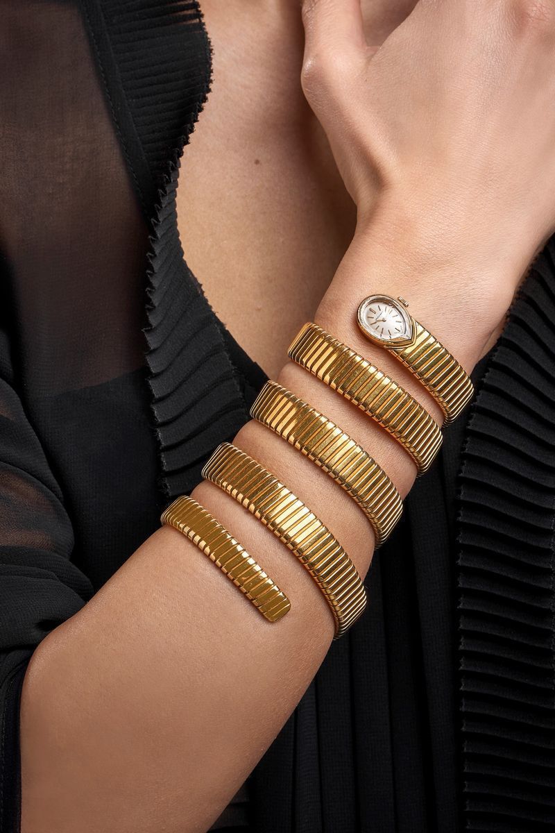 Bulgari - Bracciale orologio serpentiforme, oro giallo 18k, circa 1960
