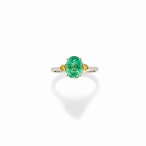 A 14k white gold ,emerald and fancy diamond ring, with certificate
