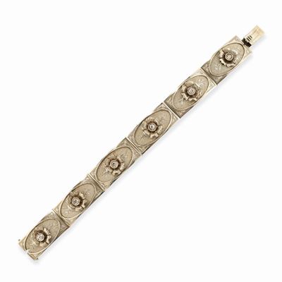 Bracciale in oro bianco 18k con decorazione floreale e diamanti