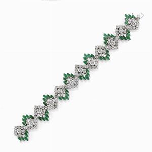 A 18K white gold, diamond and emerald bracelet, circa 1970