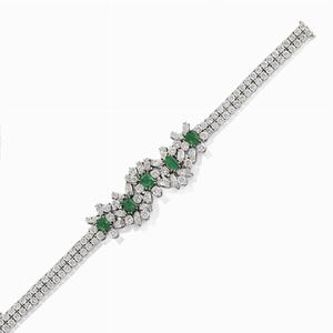 A 18K white gold, diamond and emerald bracelet, circa 1970