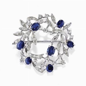 A 18K white gold, diamond and sapphire brooch, circa 1970 