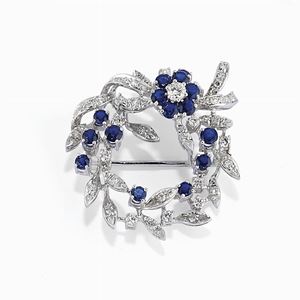 A 18K white gold, diamond and sapphire brooch, circa 1970