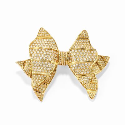 Spilla a fiocco in oro giallo 18k con diamanti taglio brillante