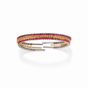 A 18k white burnished gold, 18k yellow gold and colored gemstones bangles
