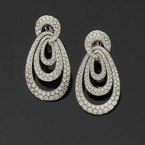 A 18K white gold and diamond earrings