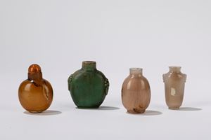One porcelain and three agate snuff bottles. China, late 19th c.