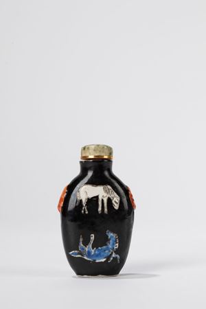 A black ground porcelain snuff bottle. China, late Qing dynasty
