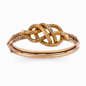 A 18K yellow gold and stones bangle, 19th Century
