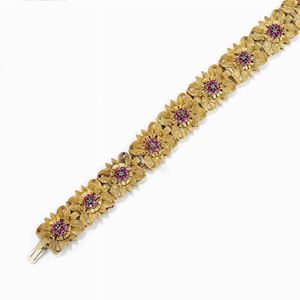 A 18K yellow gold, emerald and ruby bracelet, defects