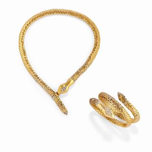 A 18k two-color gold and diamond demi parure, with necklace and bracelet, defects