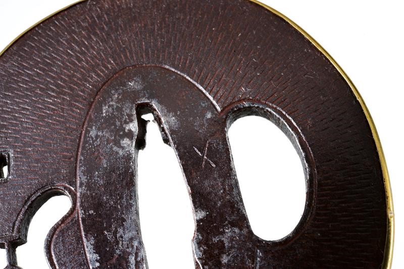 Elegante Tsuba della Scuola Umetada