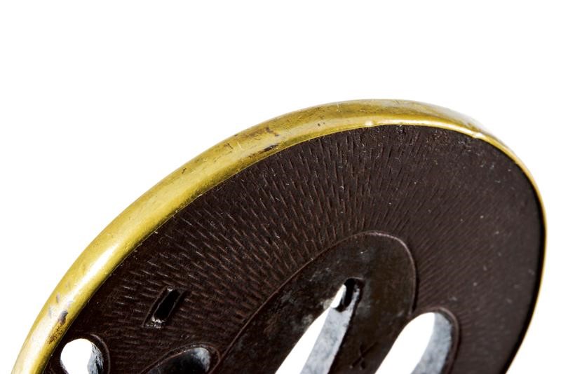 Elegante Tsuba della Scuola Umetada