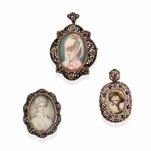 Three 18k yellow gold, silver, red and blue stone pendants