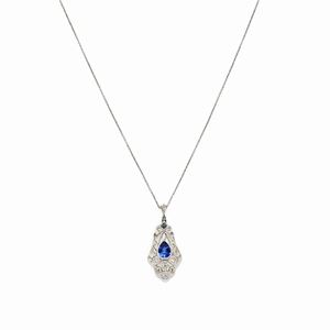A 18k white gold, synthetic sapphire and diamond pendant with silver chain