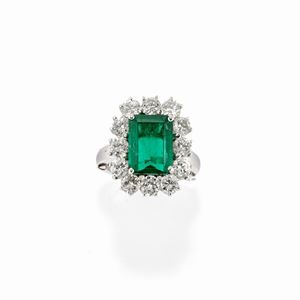 A 18k white gold, emerald and diamond ring, with certificate