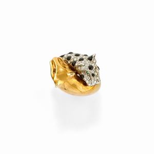 A 18k two-color gold, diamond, enamel and emerald ring