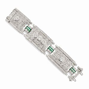 An important 18k white gold, diamond and emerald bracelet