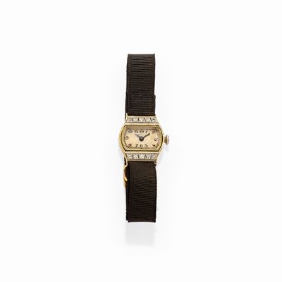 Orologio in oro giallo 18k e platino con decoro in diamanti