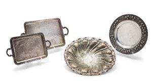 Two silver plates and two trays with handles