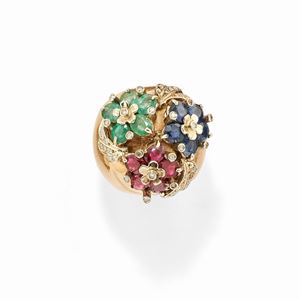 A 18k two-color gold, emerald, ruby, sapphire and diamond ring