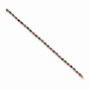 A 18k yellow gold, ruby, sapphire, emerald and diamond bracelet