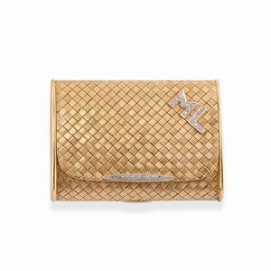 A 18k two-color gold and diamond compact
