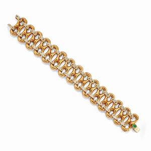 A 18k two-color gold, diamond and emerald bracelet, circa 1950