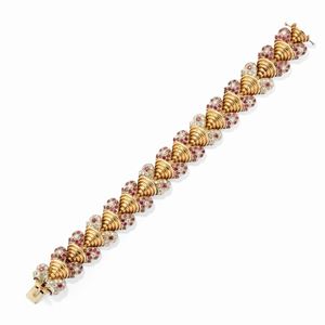 A 18k two-color gold, diamond and ruby bracelet, circa 1950