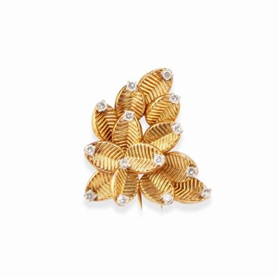 Spilla a foglia in oro bicolore 18k con diamanti