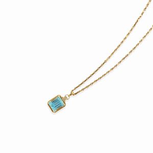 A 18k two-color gold, blue topaz and diamond necklace