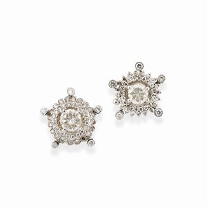 A 18k white gold and diamond earrings, defects (asymmetrical)