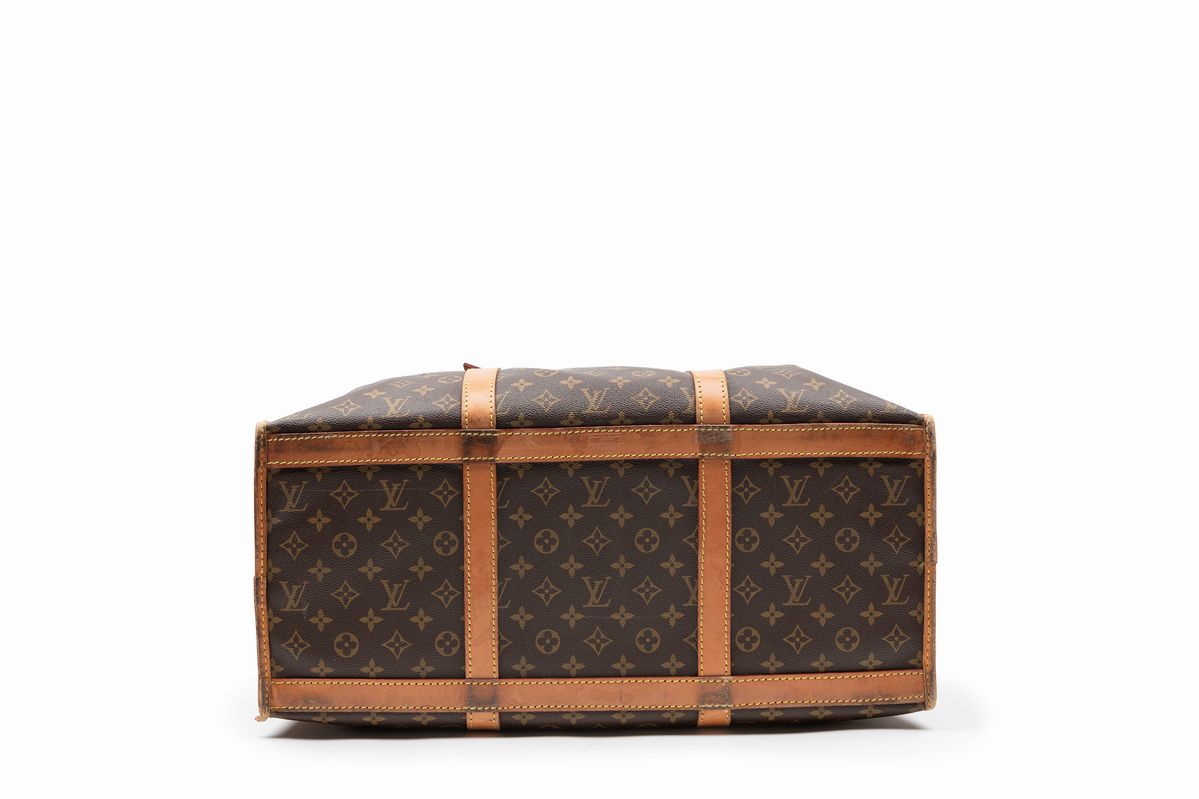 Louis Vuitton - Borsone da viaggio in tela monogram con profili in vacchetta, cm 54x24x35