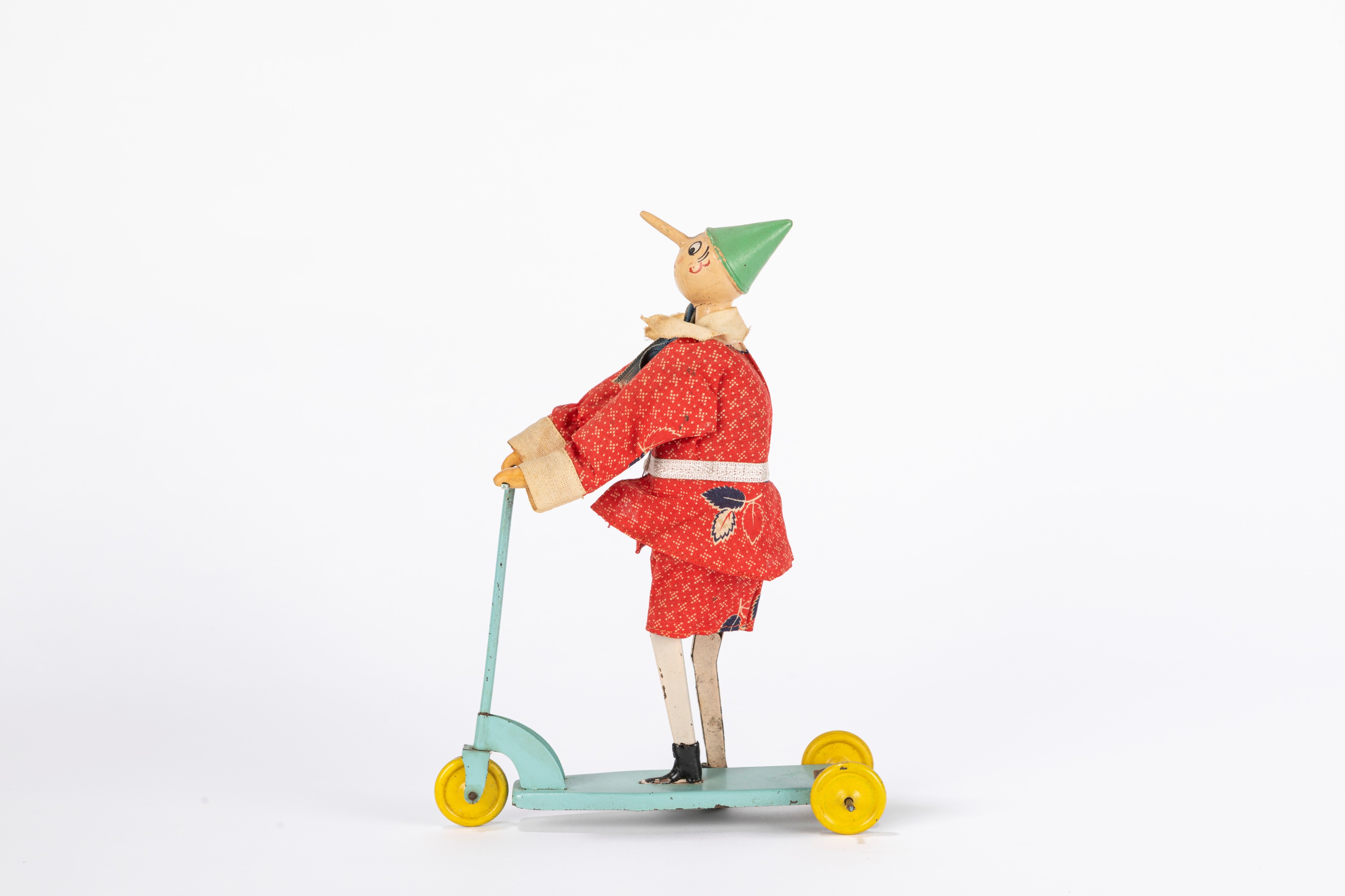 Sigi - Giocattolo d'epoca, Pinocchio su triciclo in latta con molla