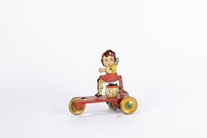 Little girl on tricycle