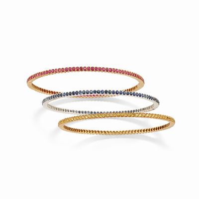 Bracciali rigidi in oro bicolore 18k con pietre preziose multicolori