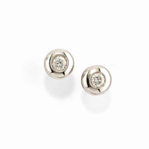 A 18k white gold and diamond earrings