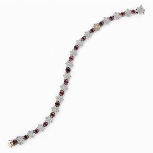 A 18K two-color gold, diamond and ruby bracelet