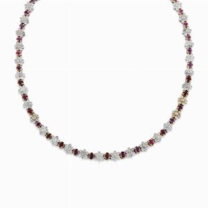 A 18K two-color gold, diamond and ruby necklace