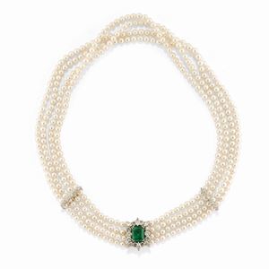 A 18k white gold, cultured pearl, emerald and diamond necklace