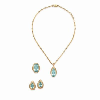 Parure in oro bicolore 18k con topazi azzurri e diamanti