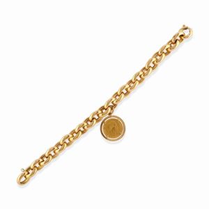 A 18k yellow gold bracelet with coin
