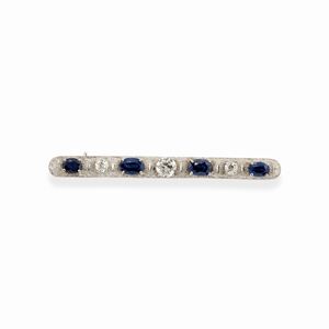 A 18k white gold and sapphire brooch
