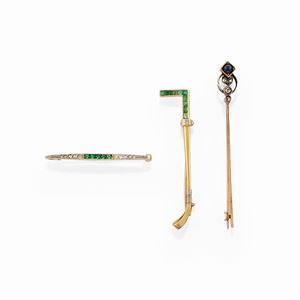 Three 18k two-color gold, silver, emerald, diamond and sapphire brooches