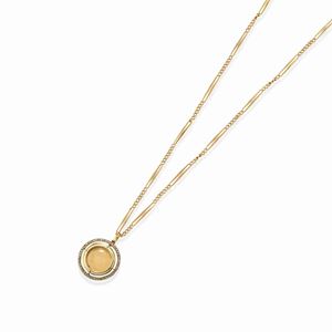 A low-carat gold, silver and diamond pendant with pocket watch chain