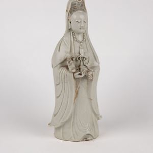 A white porcelain Guanyin with child. China, early 20th c.