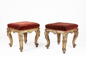 Pair of carved and gilded wooden stools. XVIII century