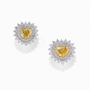 A 18K white gold with Fancy Yellow diamond earrings 