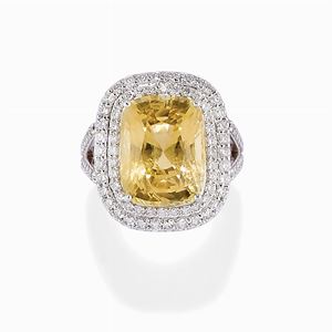 A 18K white gold, yellow sapphire and diamond ring  