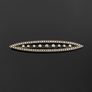 A gold, silver and diamond brooch